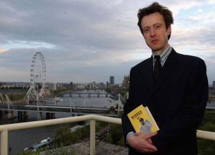 Editor Tim de Lisle with a copy of the 2003 <i>Wisden Cricketers' Almanack</i>